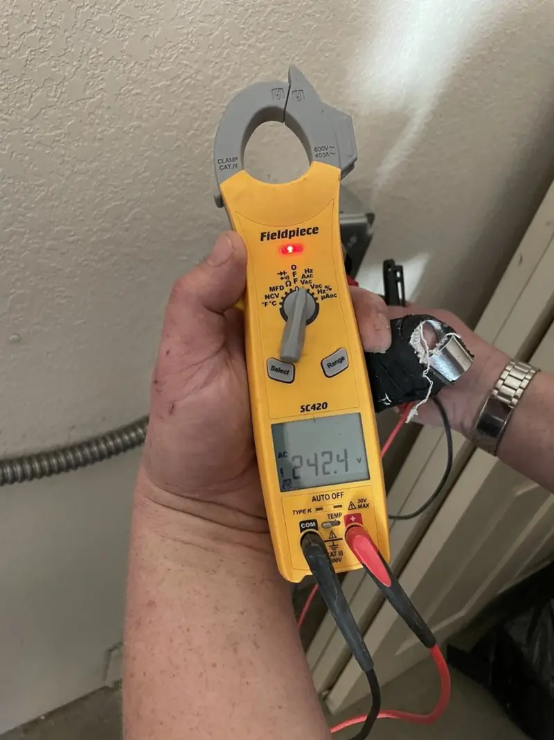 Voltage testing with clamp meter during Recessed Lighting Installation in Jefferson Hills